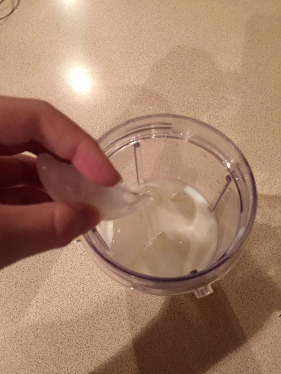 Add about a cup of milk, and a cup of ice to the blender. (The ingredients are not exact)