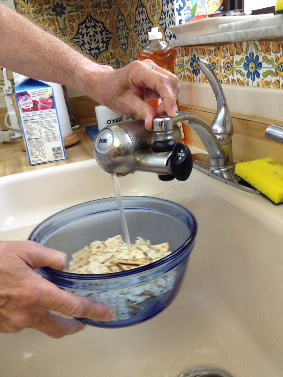 Add about a cup of water to the matzah to dampen