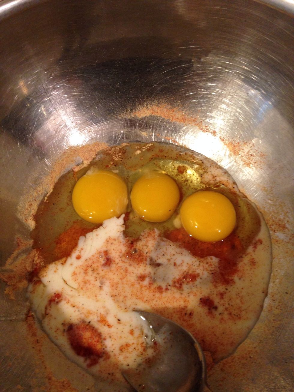 Add about a cup or so of milk and 3 eggs. Whisk this up and you are almost done!