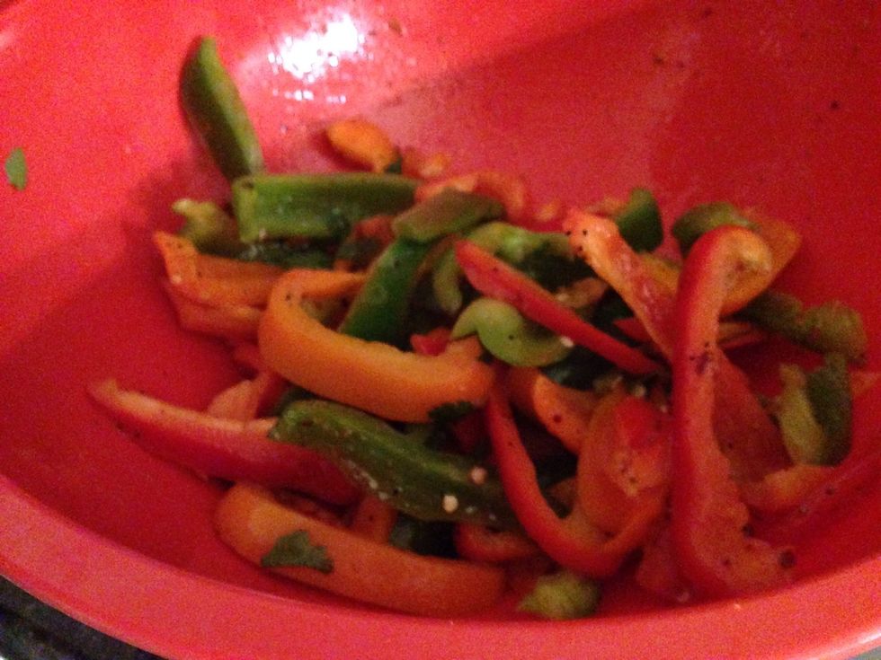 Add about a half cup of oil to your peppers in a medium sized bowl. Add all dry seasoning ingredients to this mixture. Incorporate well, let sit and marinate.