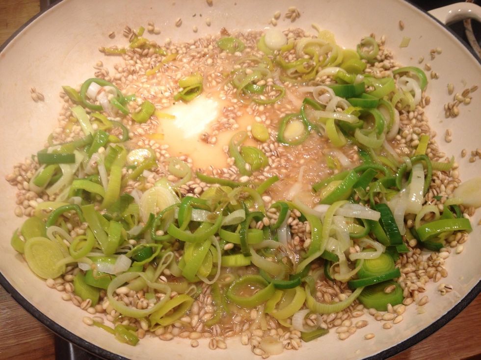 Add about a wine glass worth of boiling water, stir until it is absorbed. Add the water gradually, about half a litre in total. Put the lid on and cook for about 20 mins. Stir occasionally.