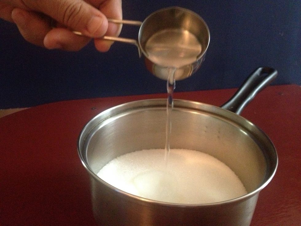 Add about \u00bc cup of water to sugar just to wet it. Adjust where necessary.