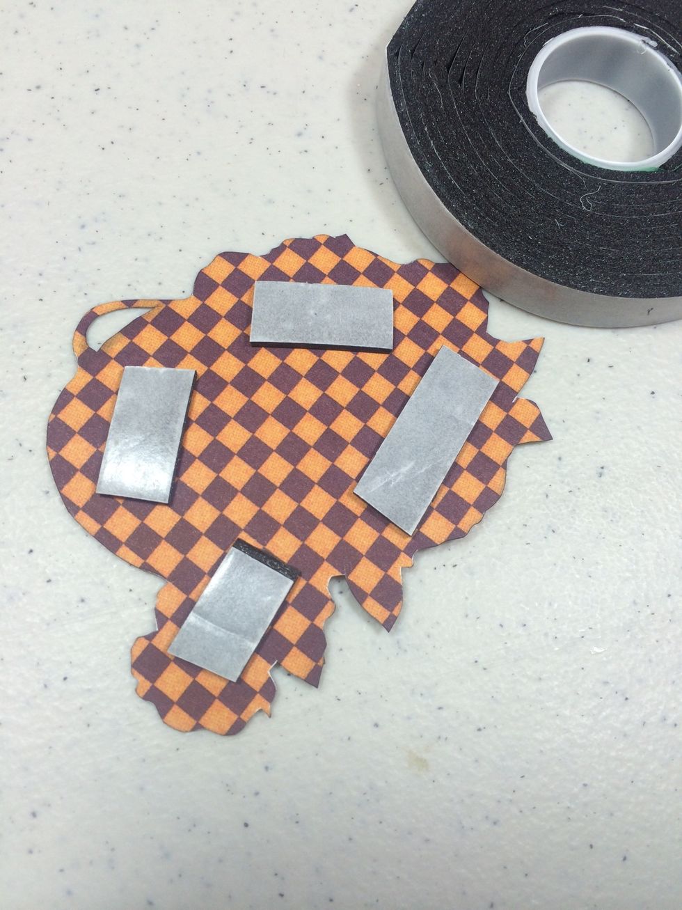 Add adhesive foam tape to the back to pop it up.