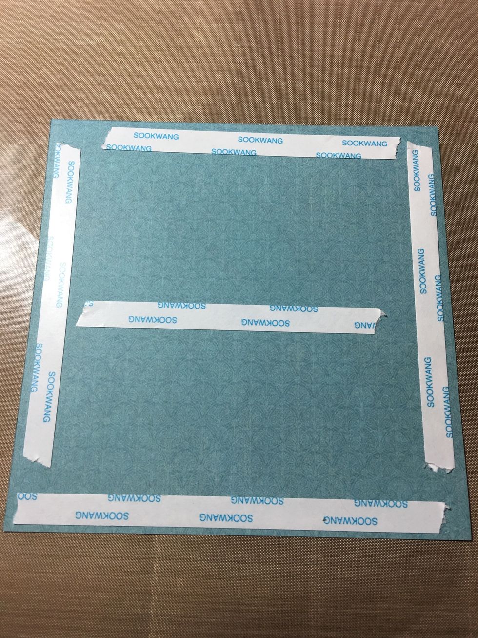 Add adhesive of your choice to the back of paper