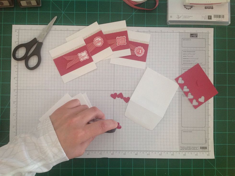 Add adhesive to each heart.