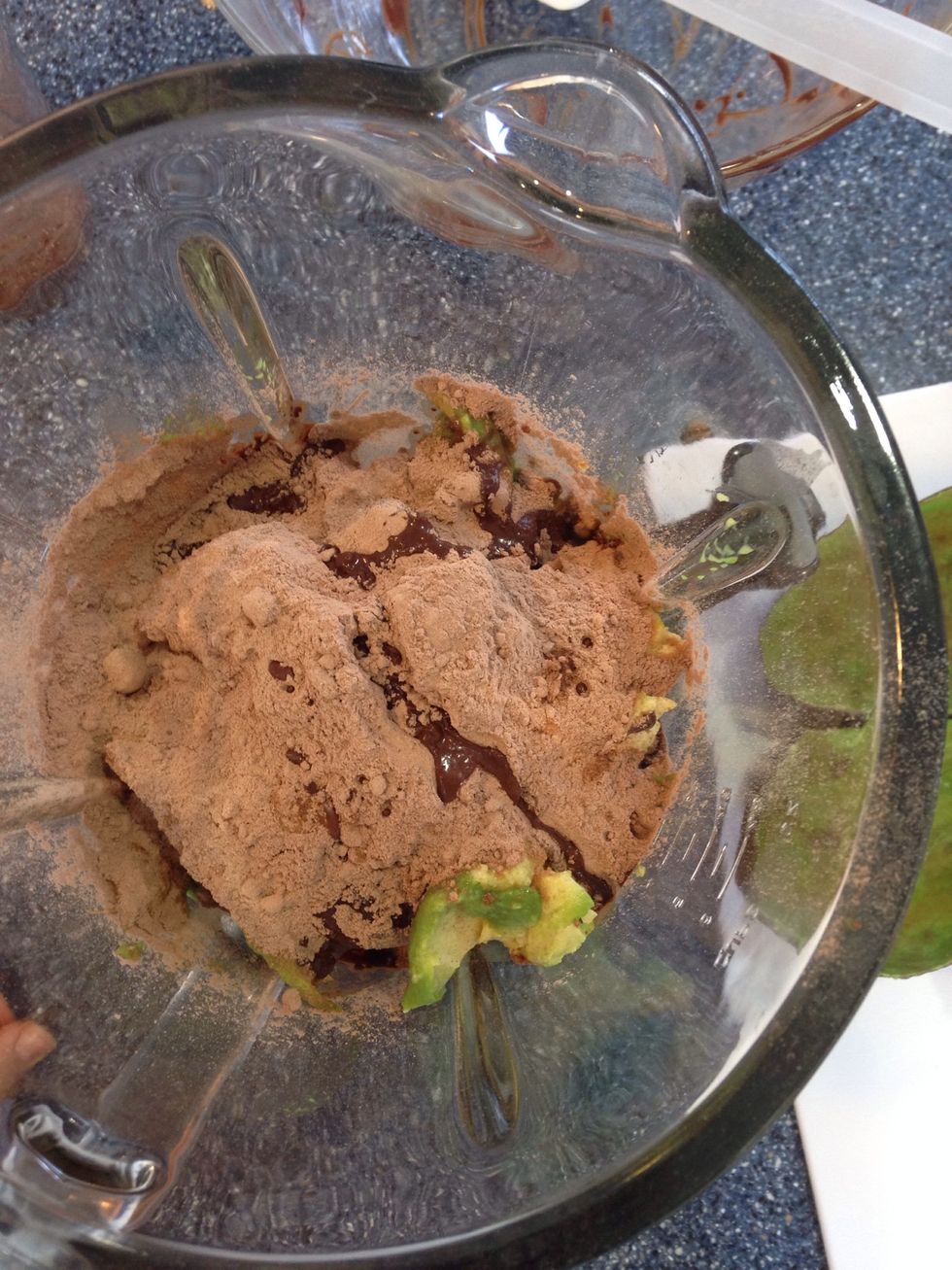 Add all ingredients into a food processor or blender: melted chocolate, powder, avocado, vanilla extract, almond milk, agave etc
