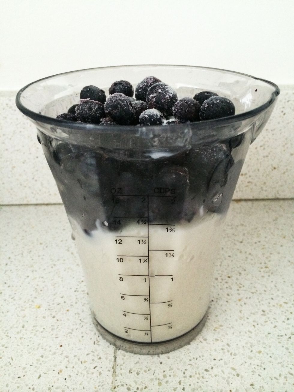 Add all ingredients into blending cup. Even though Greek style yogurt is all the rage, European style blends quickest...and plain has the lowest grams of sugar. Straus is my go to option