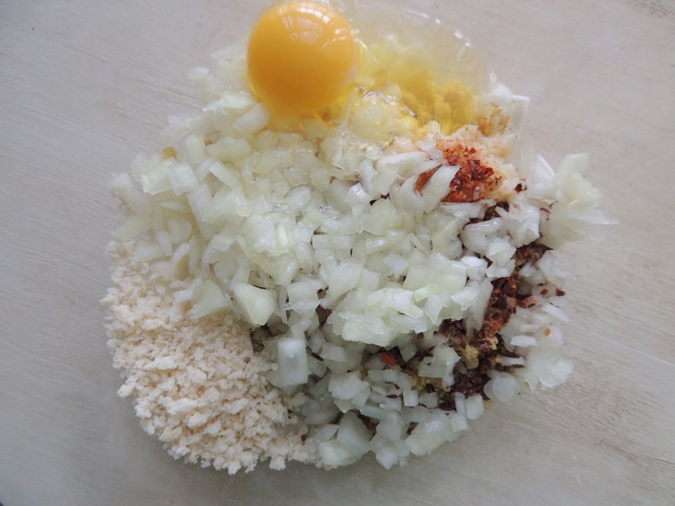 Add all of your burger ingredients except the beets and bread crumbs; combine well.