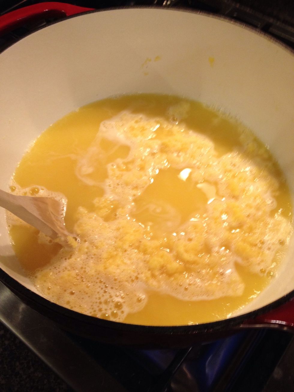 Add all of your grated Fels-Naptha. Begin stirring immediately and return your mixture to a boil. Once at a boil, turn your mixture down to somewhere between medium and medium-high.