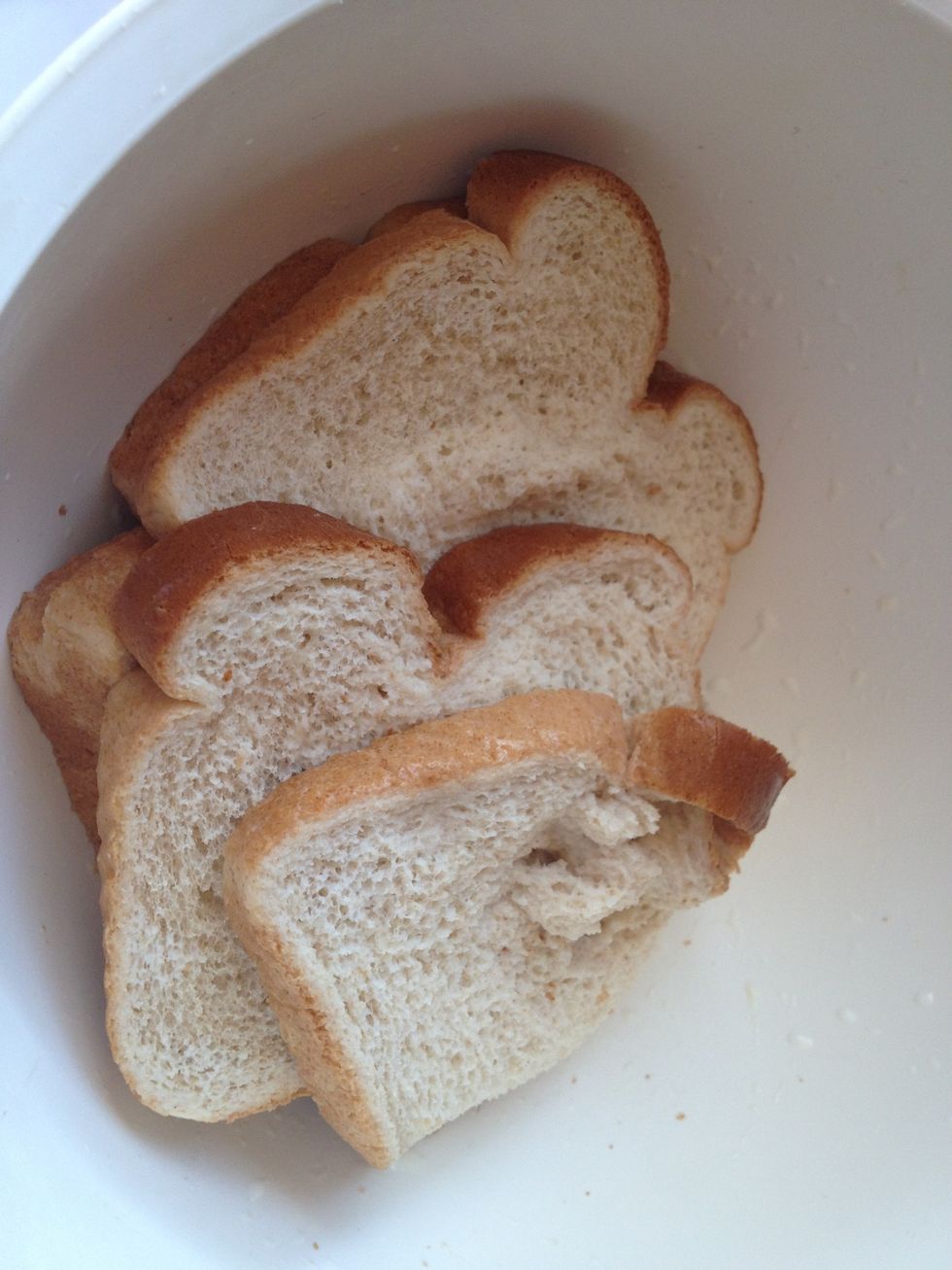 Add all the bread to a large bowl. Pour in the milk and allow the bread to soak in the milk for a few minutes