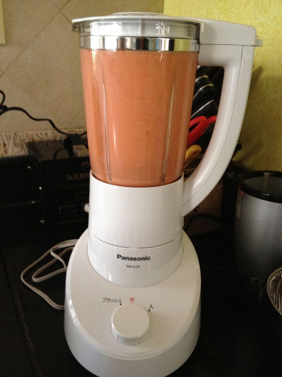 Add all the ingredients in.  Now it's blending time!  Turn it to a low mode first. You can stop the blender when there are no more chunks of fruits left.