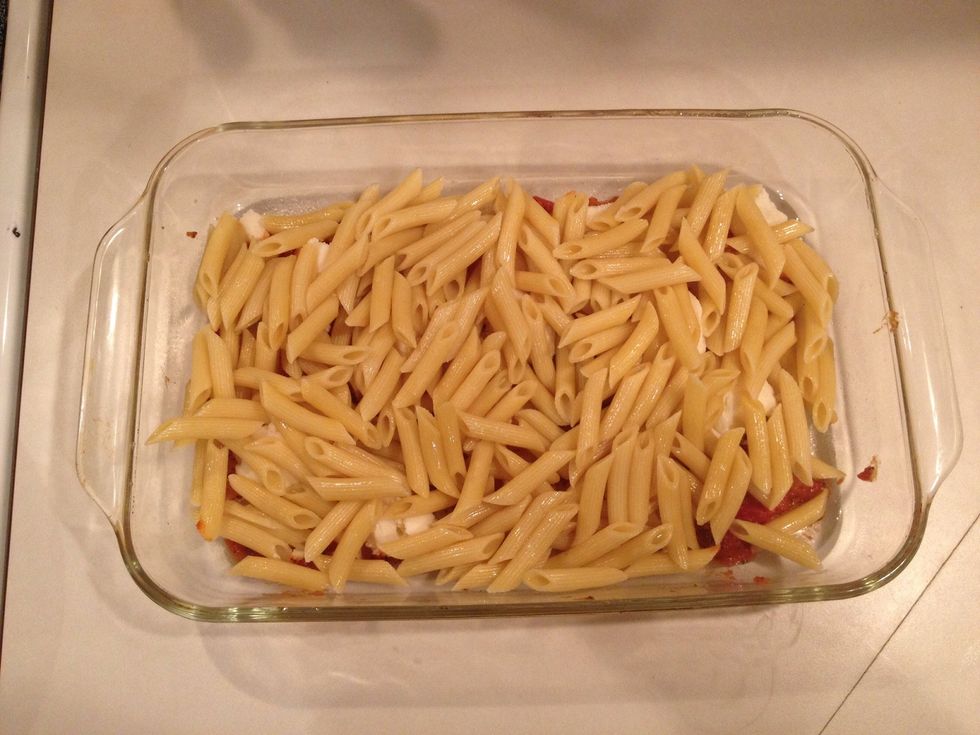 Add all the pasta and spread out evenly.