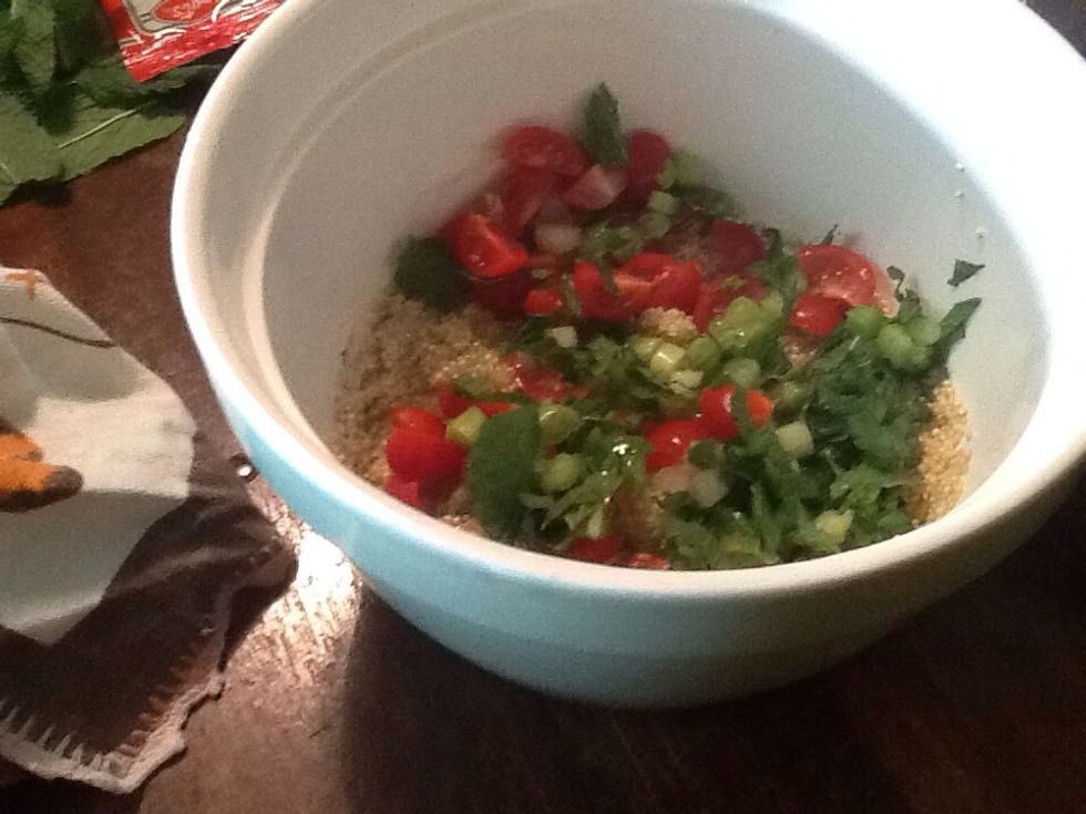 Add all vegetables and herbs into the bowl with the quinoa.