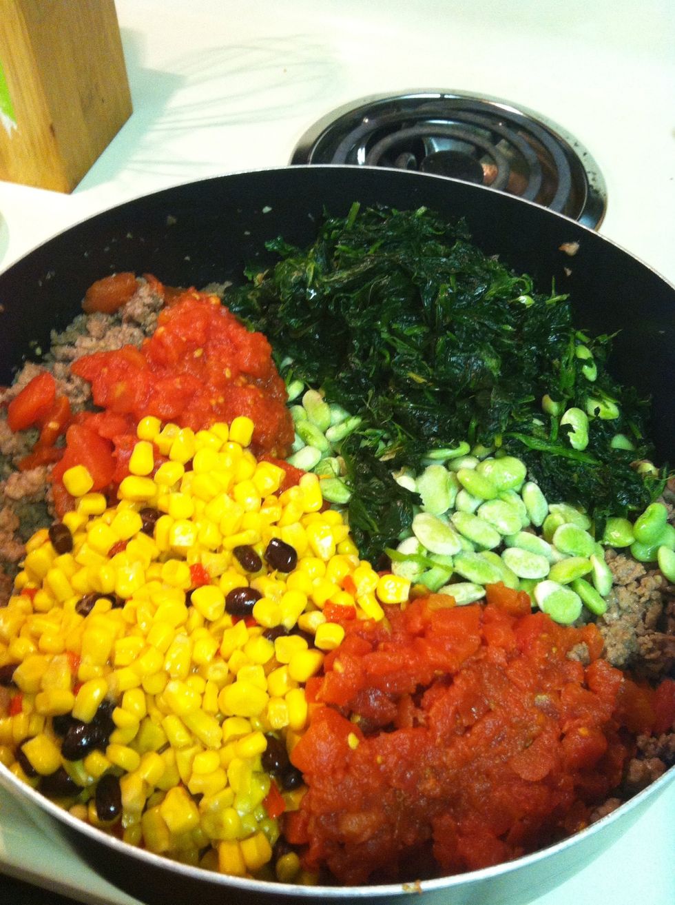 Add all veggies to the meat. I used southwest style corn which had red peppers and black beans in it. If you don't like Lima beans you could sub two cans of this corn or a different bean.