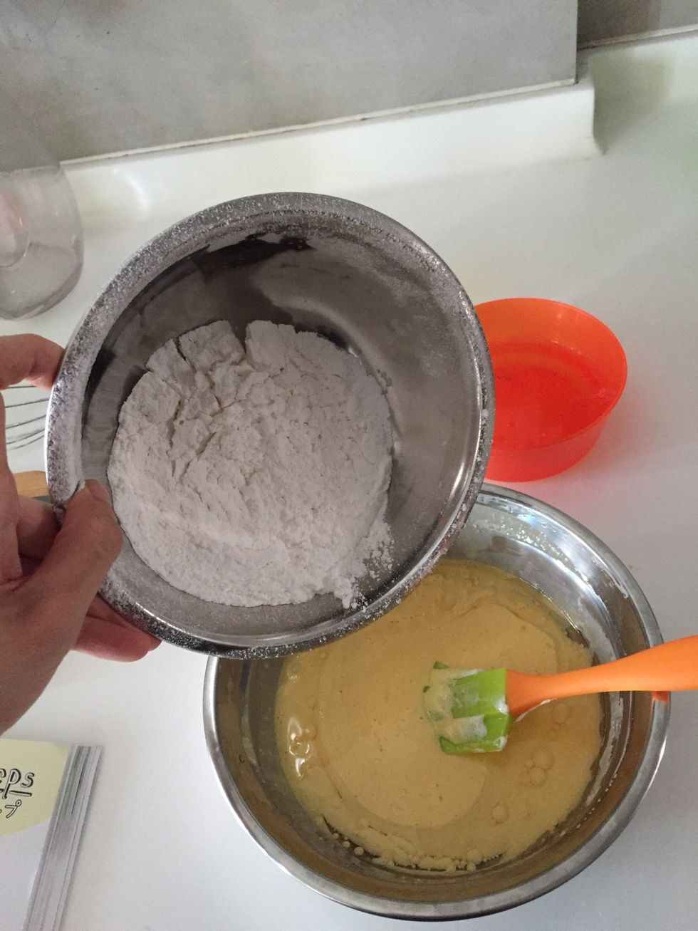 Add (already sifted) cake flour.
