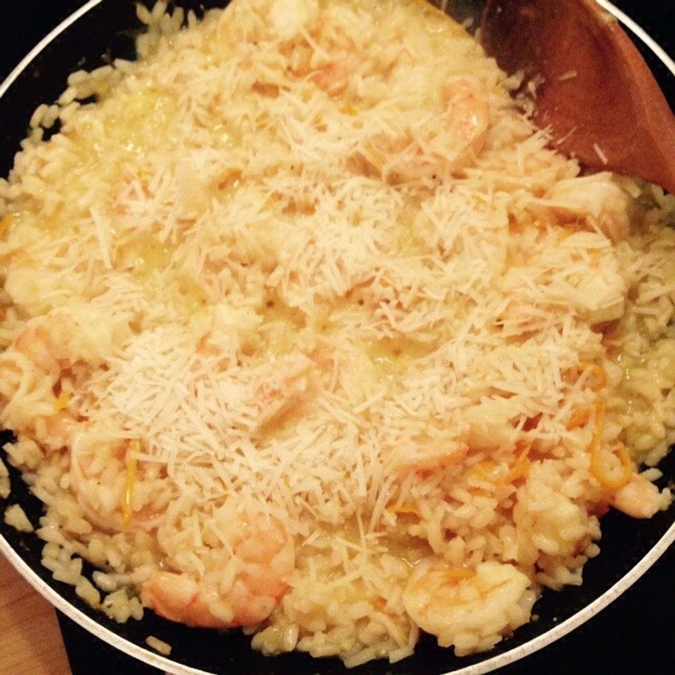 Add also the parmesan and stir together. Let rest for few minutes to help amid, butter and parmesan develop the typical risotto creaminess.