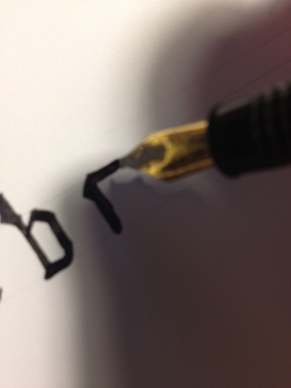 Add an embellishment to the top, then make a straight stroke across the top line.