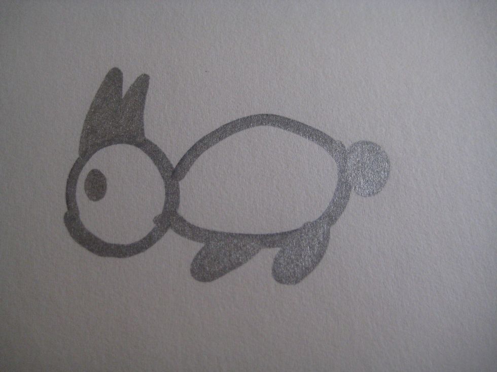 Add an eye right under the ears. Make it an oval shape.