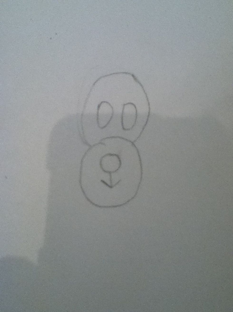 Add an oval on top of the snout and draw two smaller ovals side by side.