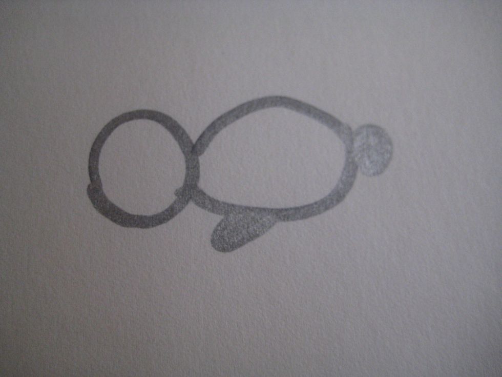 Add an oval shape under the belly, close to the head. This will be the bunny's foot.