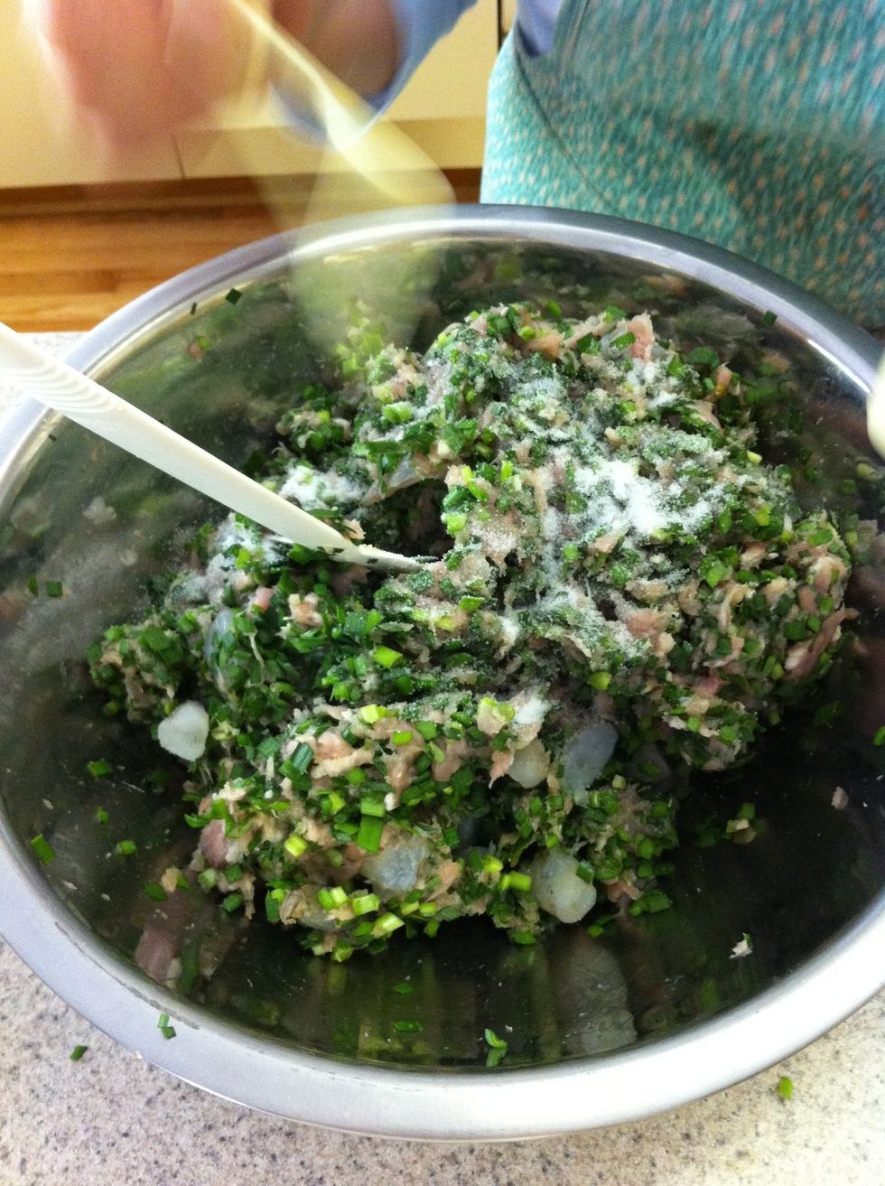 Add and mix: 1.5 teaspoon salt, 1.5 teaspoon sugar, 1 teaspoon shaoxing Wine, 2 tablespoons Dark Soy Sauce, white pepper, 1 egg yolk (egg white kept for wrapping), and Corn starch (if too moist).