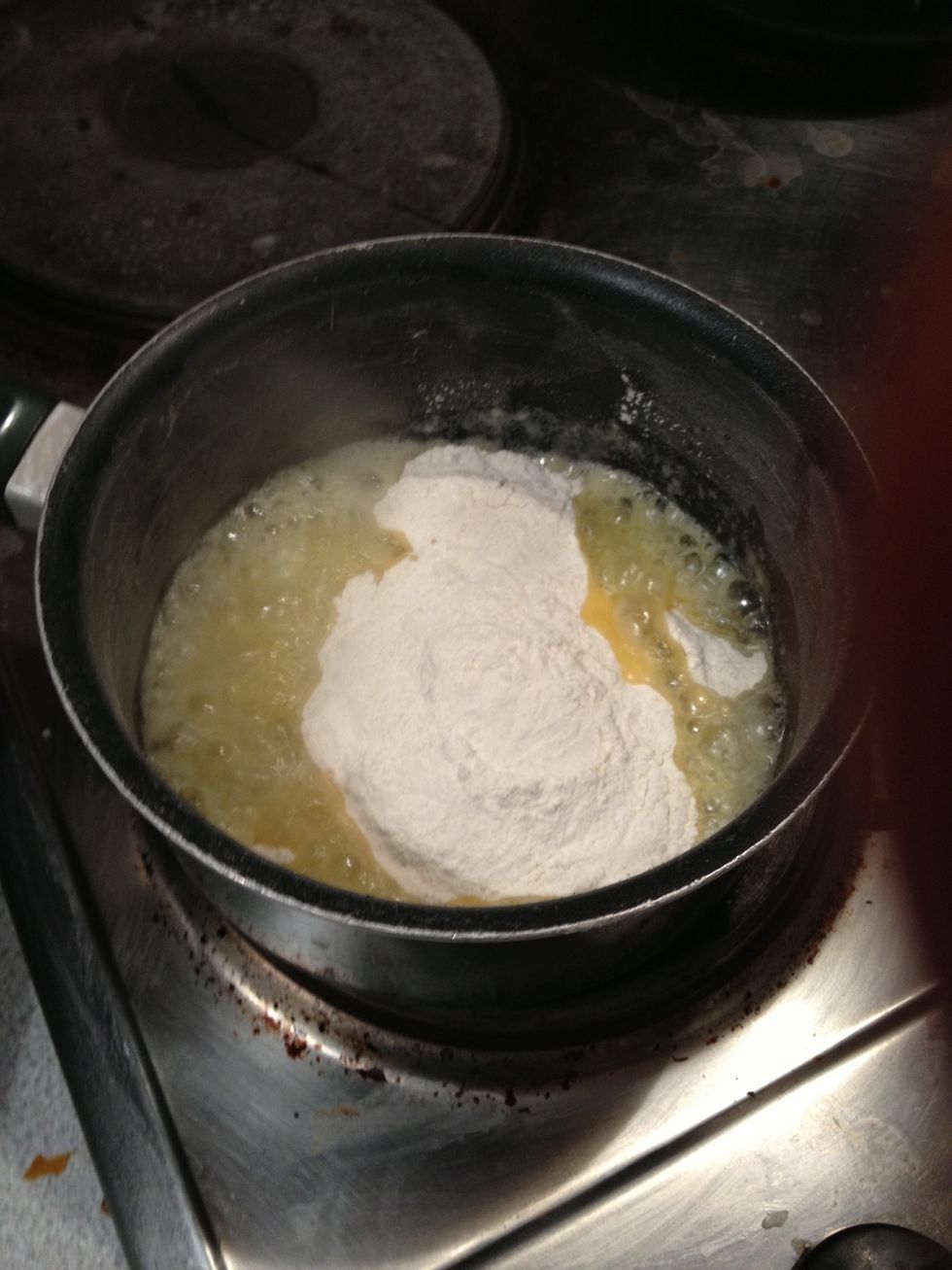 Add and mix 2oz of flour, called roux. Always move it until bubbles.