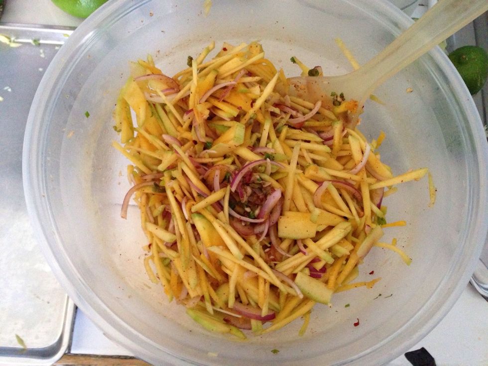 Add and Toss each time these ingredients are placed into the bowl....Mango, Red onion, Green onion, Garlic, Cilantro.