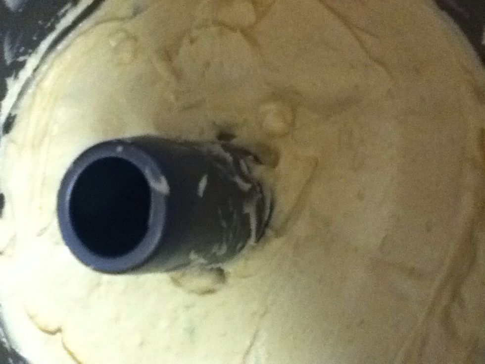 Add another 1/3 of the batter, spreading evenly over the blueberries.