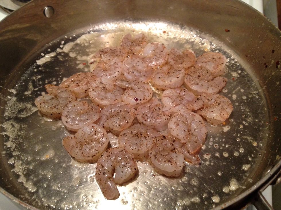 Add another 2 tbsp extra virgin olive oil to the large skillet on medium high heat. Once the pan is hot, add the shrimp in a nice even layer.