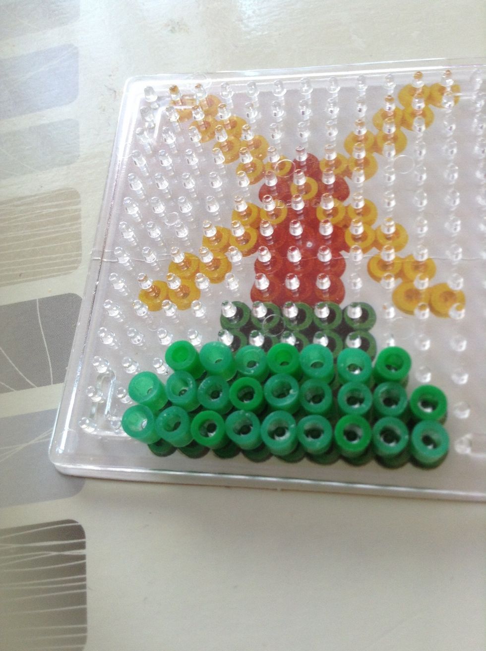 Add another 7 above the other two. Leave a gap at each side.