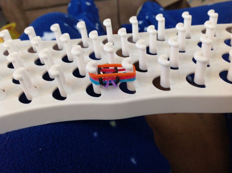 Add another band again (make sure you only have three at a time on the frame, like this picture)