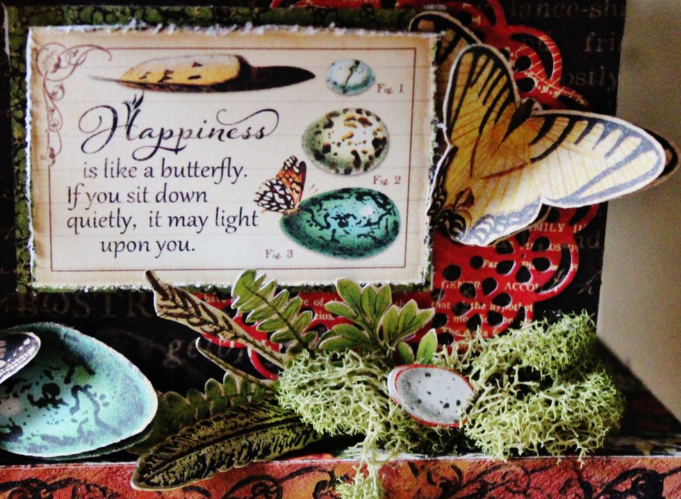 Add another journal image to the other side of birdhouse with moss, metal feather, fussy cut butterflies and eggs.