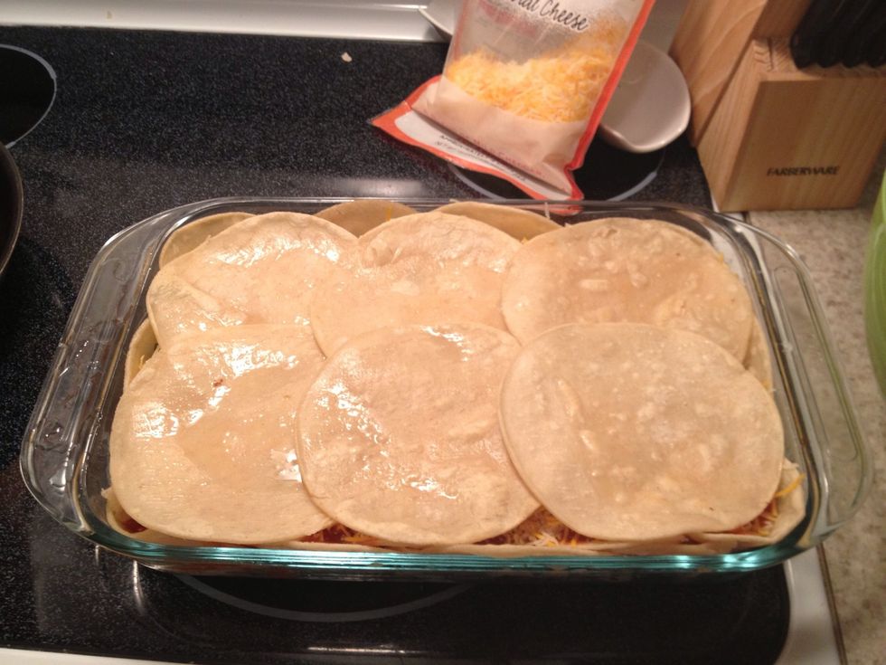 Add another layer of lightly fried corn tortillas