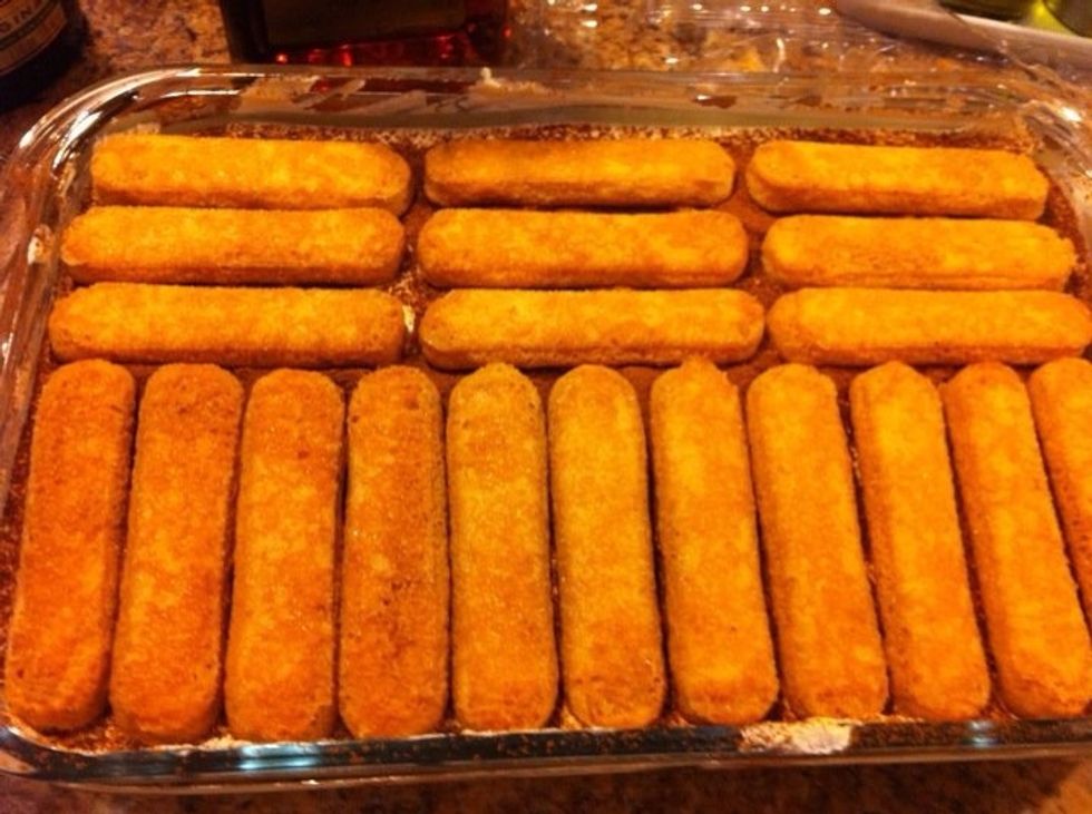 Add another layer of the coffee dipped cookies.