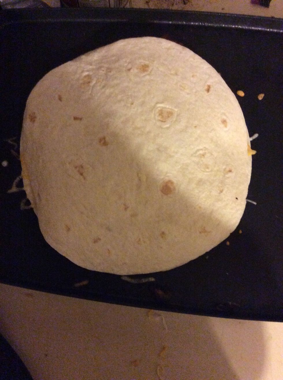 Add another tortilla and flip to make the cheese on top melt