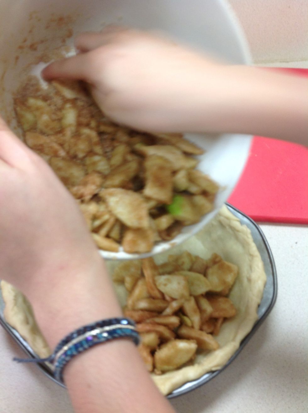 Add apples into pie crust