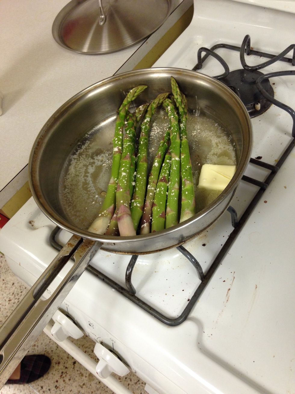 add asparagus spears and garlic stirring occasionally.