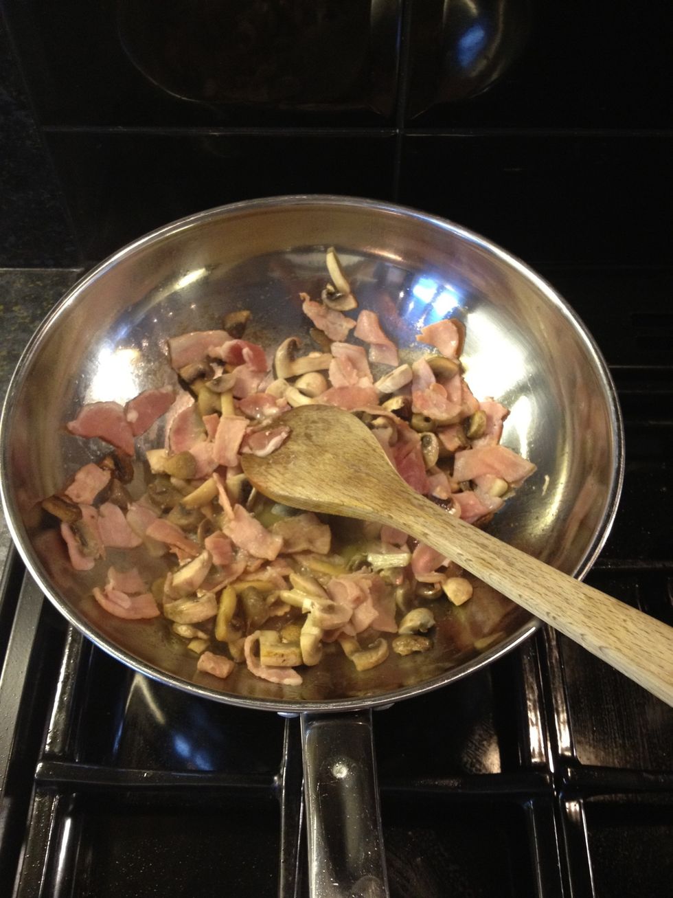 Add bacon and mushrooms to frying pan and cook