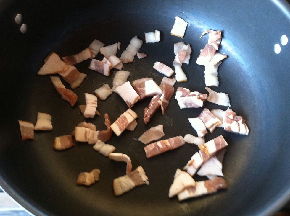 Add bacon pieces to Dutch oven