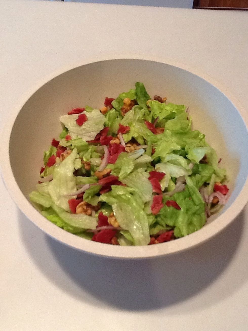 Add bacon to salad.