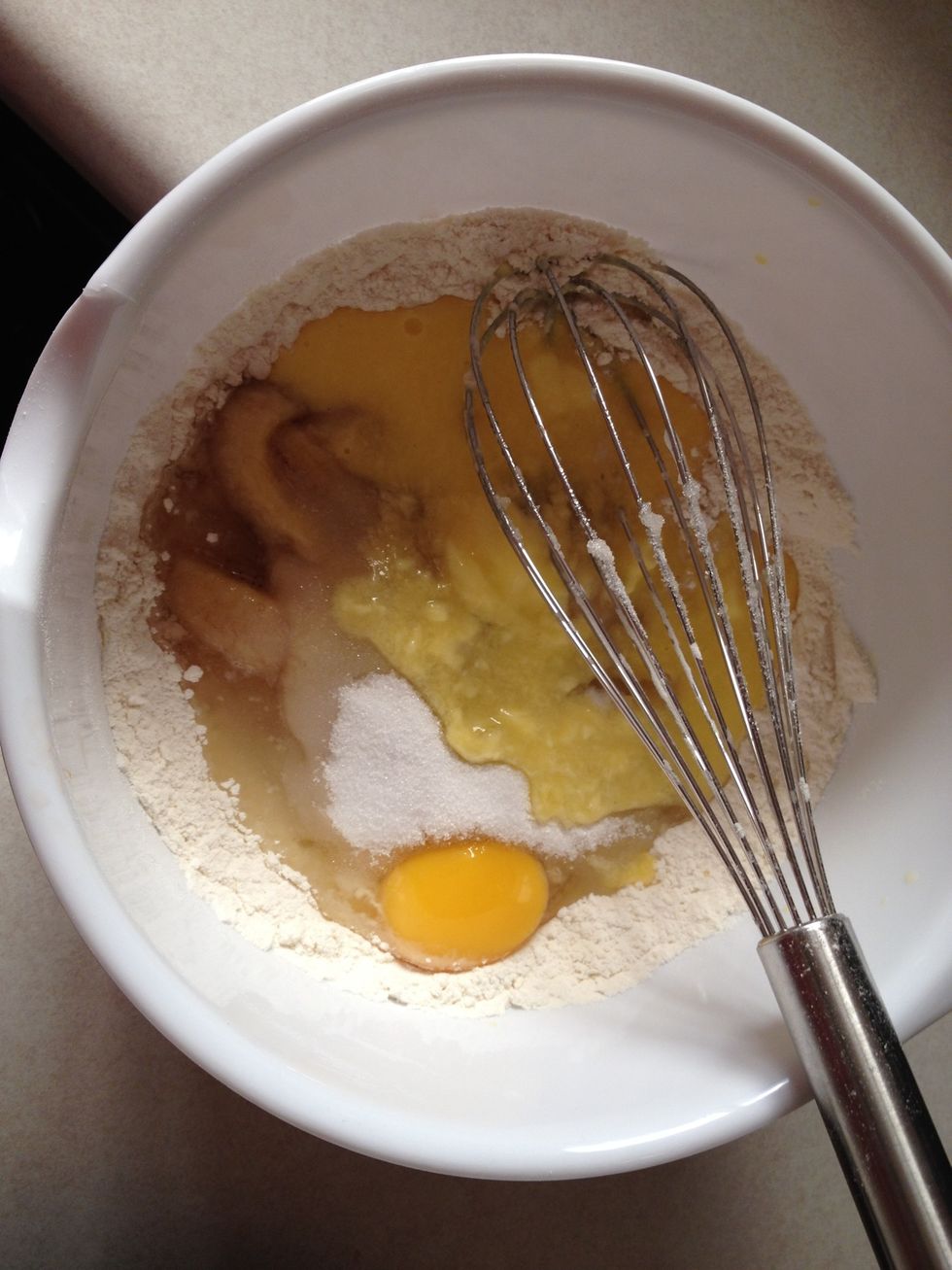 Add bananas, sugar, egg, and butter.