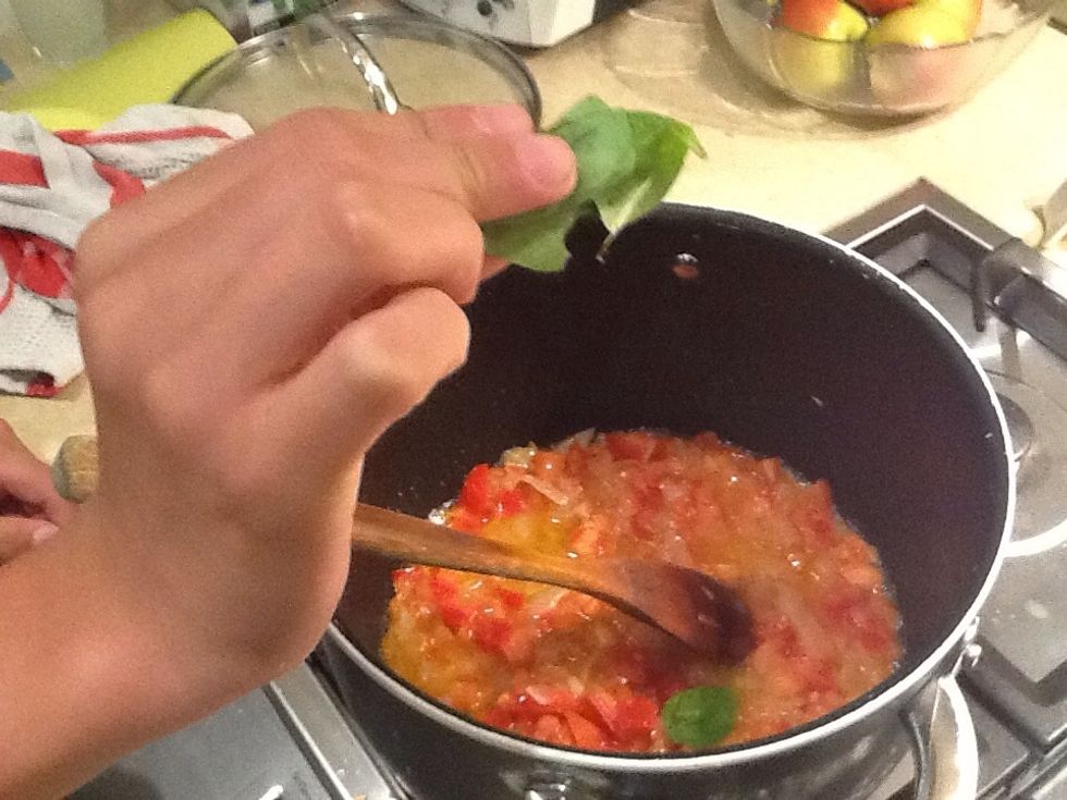 Add basil and stir through