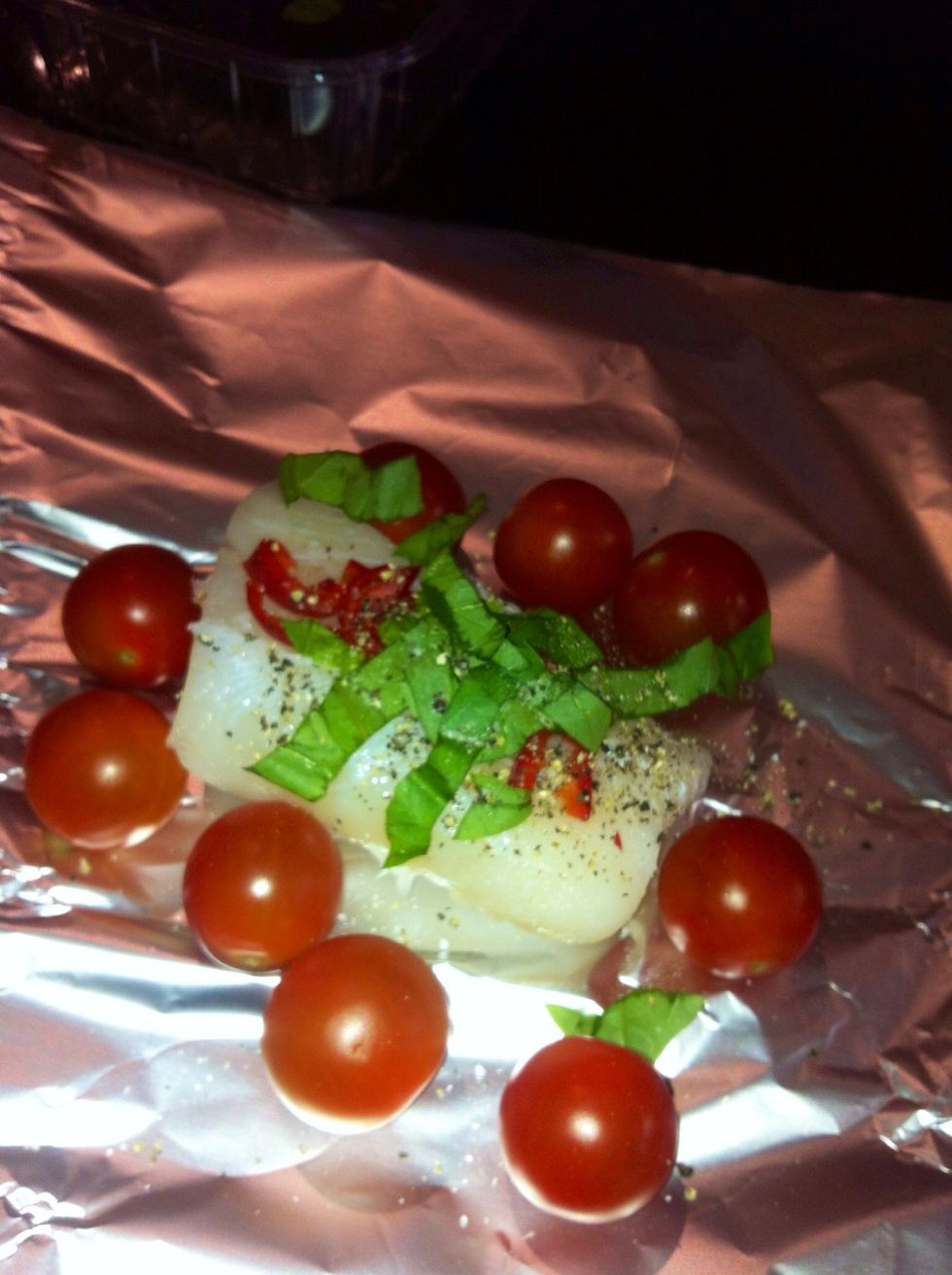 Add basil leaves chopped and cherry tomatoes drizzle with olive oil and season with salt and pepper