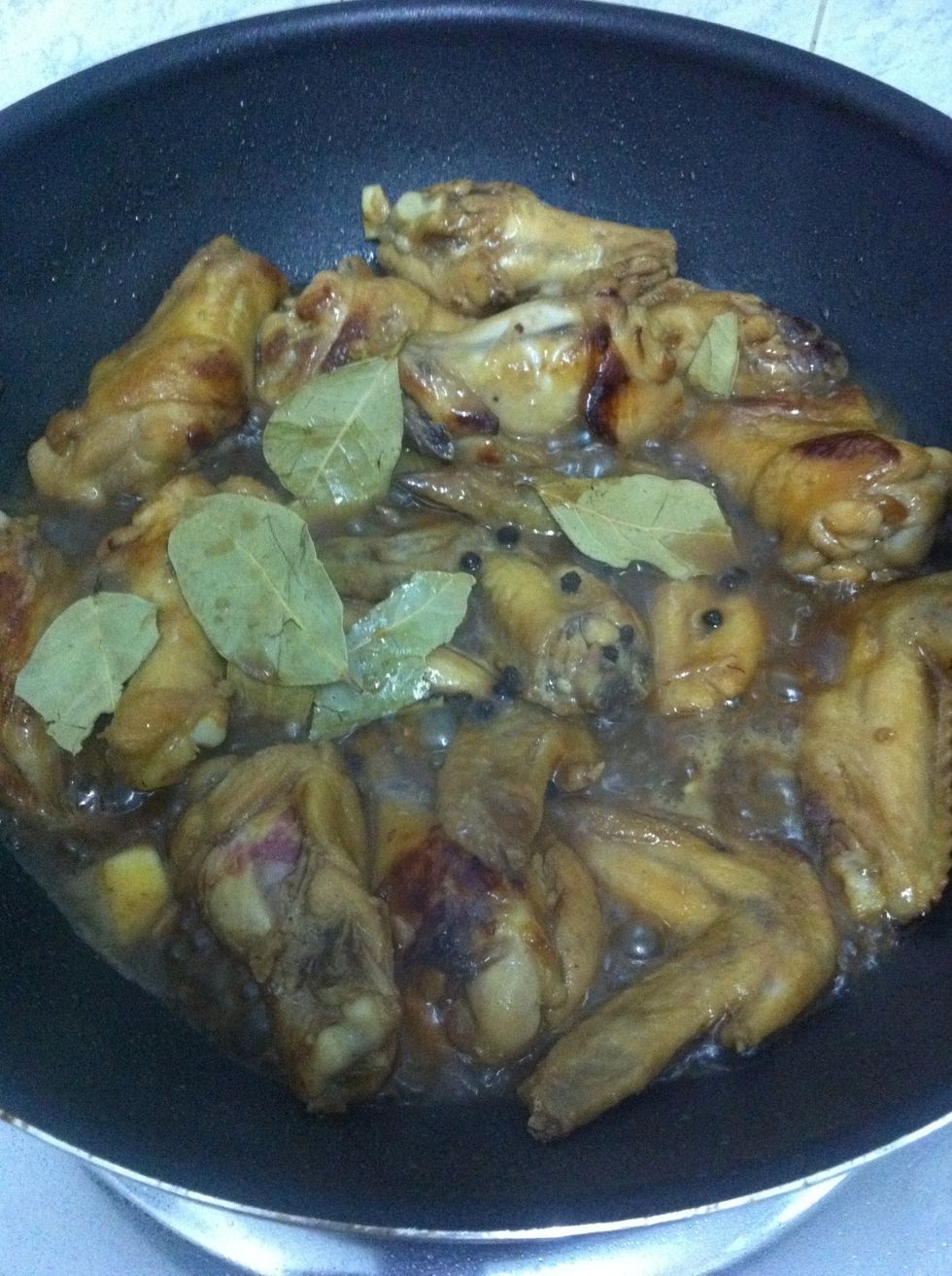 Add bay leaves and peppercorn and simmer until the chicken is cooked