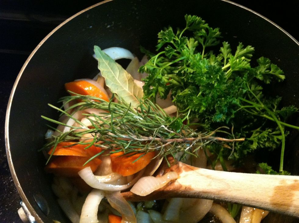 Add bay leaves, rosemary and thyme, parsley and carrots