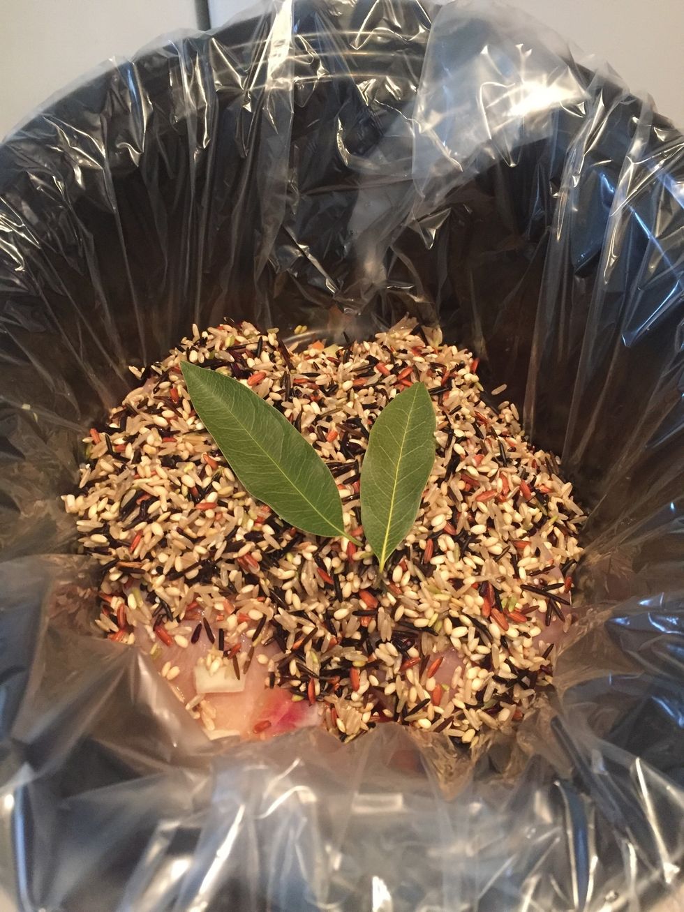 Add bay leaves. Sprinkle poultry season on top (not shown because I forgot to add mine until later.)