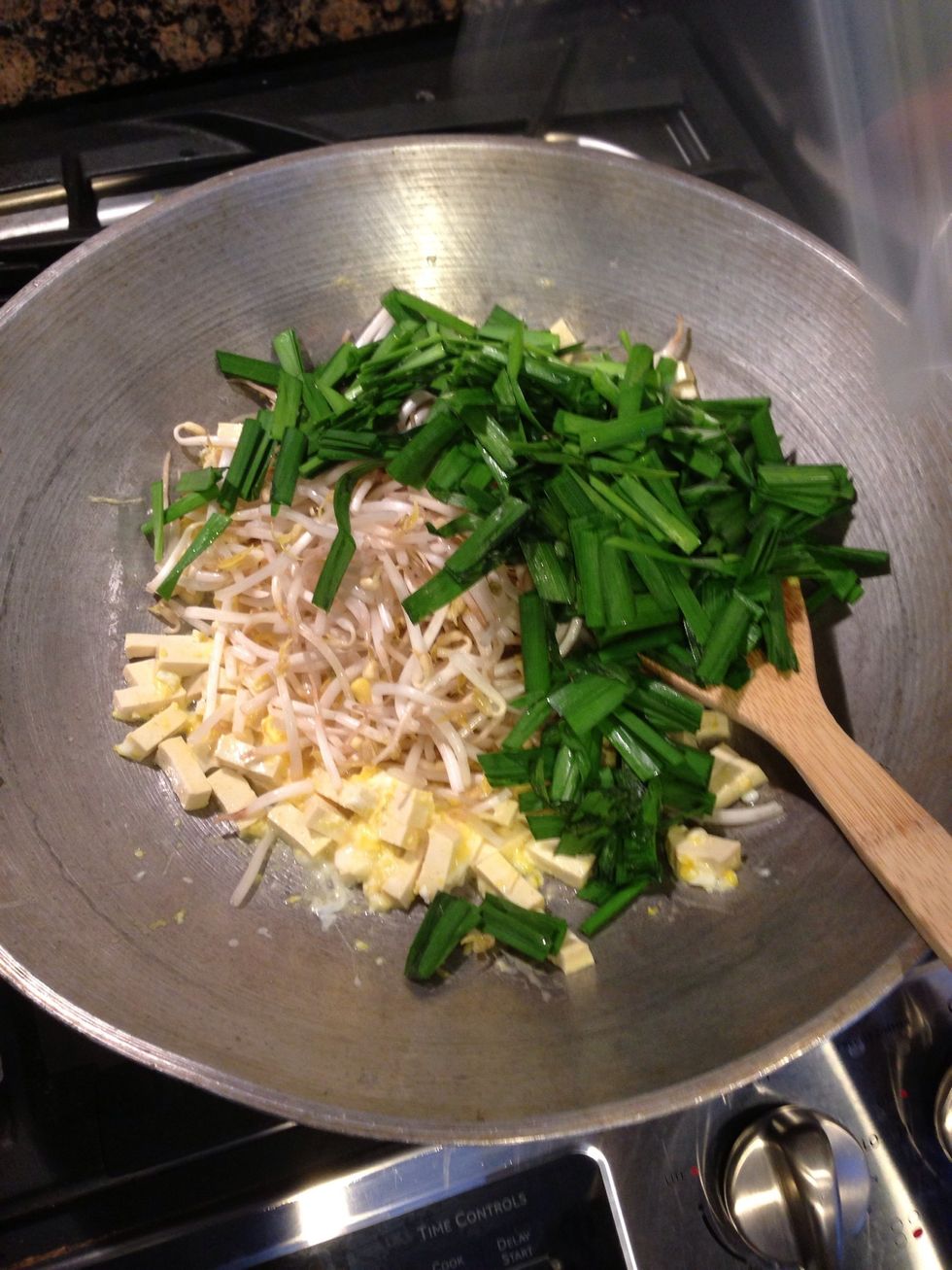 Add bean sprouts and Chinese chives.