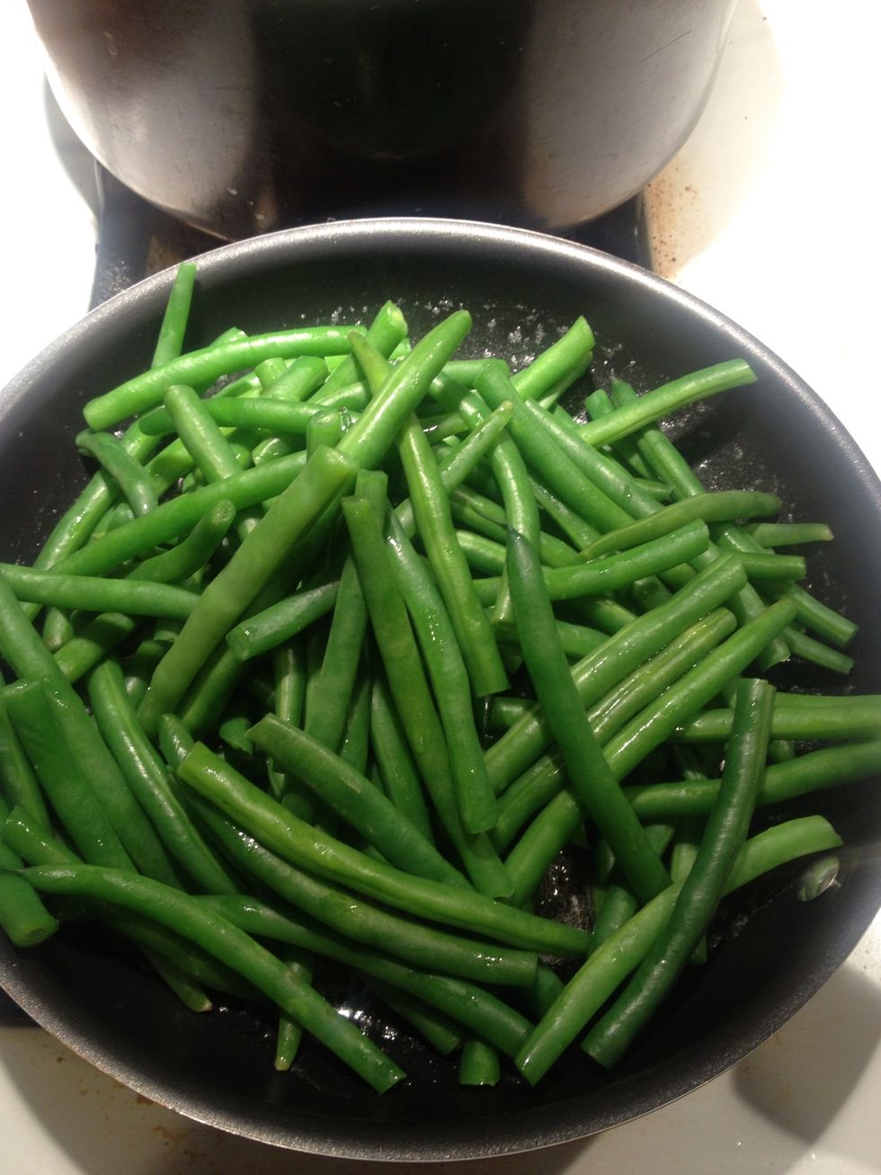 Add beans and saute for 5-7 minutes until tender.. Season with S&P and finish with red chile flake.