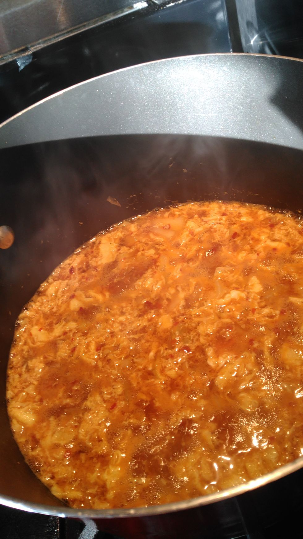 Add beaten eggs into soup.