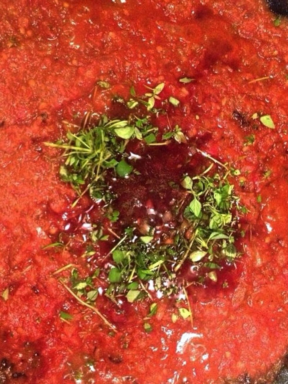 Add beef broth, tomato paste and sambal oelek (or if you don't have any/run out add chili flakes to your liking)